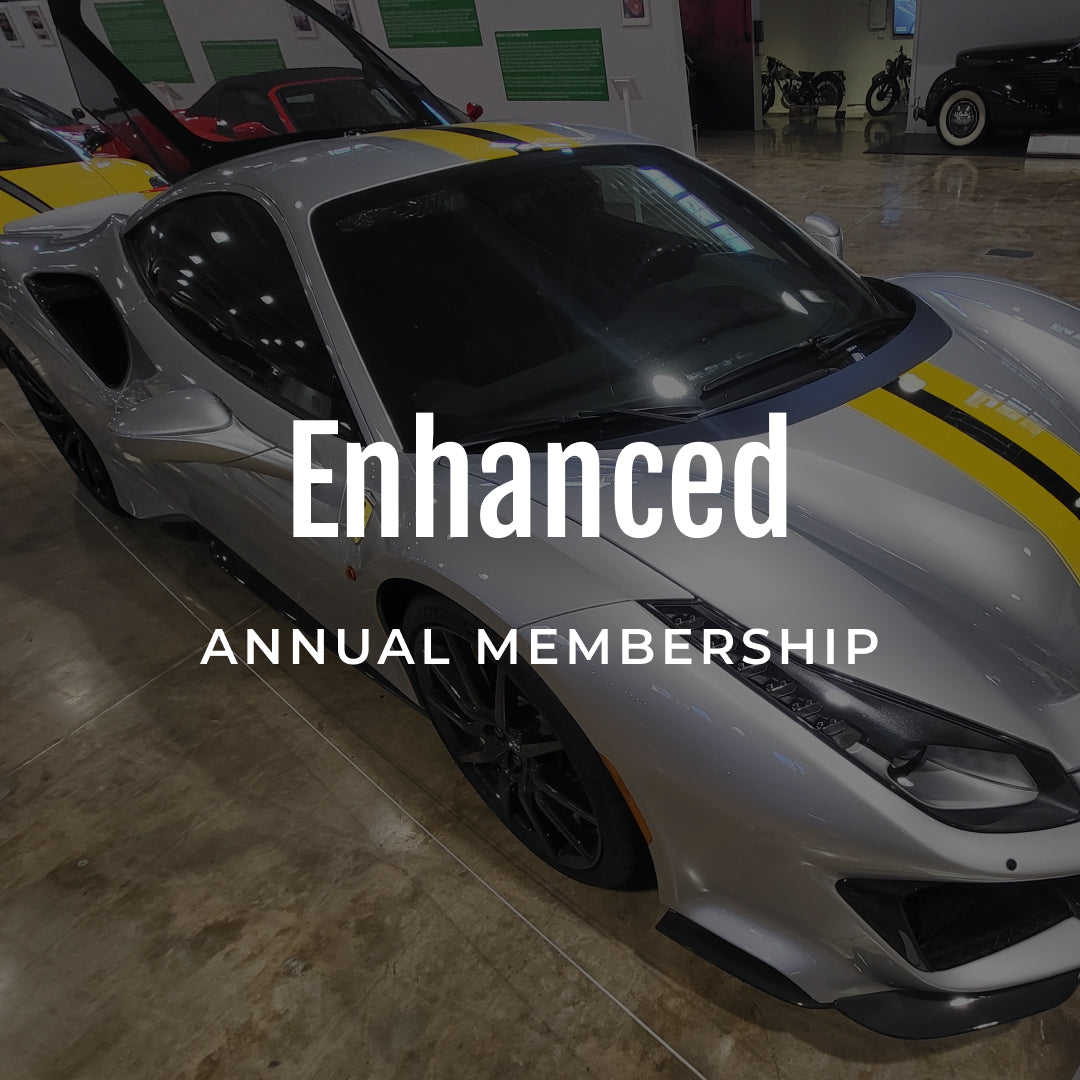 White sports car with yellow stripes in a showroom, text overlay 'Enhanced Annual Membership'.